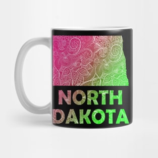 Colorful mandala art map of North Dakota with text in pink and green Mug